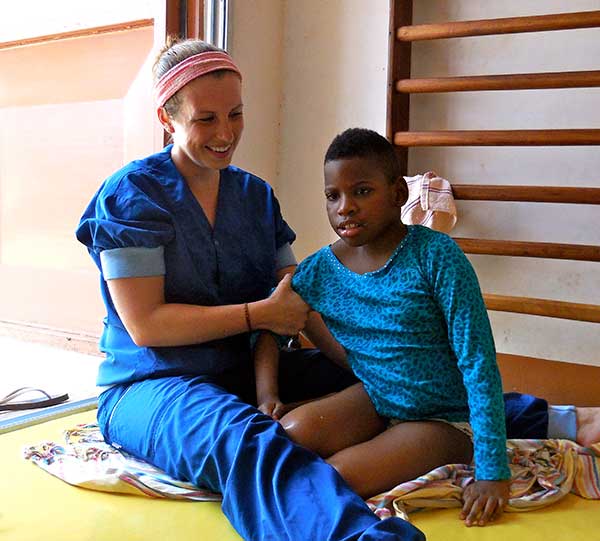A physiotherapist working with a child
